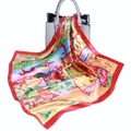 Colorful oil painting silk scarf with red border elegantly draped over a grey handbag - Oil Painting House
