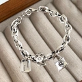 Vintage silver chain bracelet featuring a Good Luck square charm and star bead charms - Good Luck Lock Style-SL0820