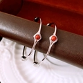 Macro detail of silver open bangles with polished finish and central red stone inlay - Silver (Silver Pin) / Silver