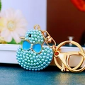 Sparkling blue faux pearl duck keychain with golden metal ring and lobster clasp - Sky Blue Pearl Duck