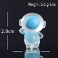 Leuchtende Astronauten-Figur aus Harz, Miniatur-Deko in Blau, Höhe 2,8 cm für Tisch - Stehender Astronaut