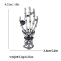 Detailed view of punk skeleton hand brooch with size dimensions and blue rhinestone - Silver 1682-SL