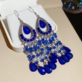 Detail view of vintage boho earrings with blue rhinestones and dangling bead tassels - Hook Style / Dark Blue