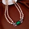 Detailed close-up of a double-layer pearl necklace with a green gemstone clasp and silver accents - Necklace - Double Layer Pearl with Green Pendant