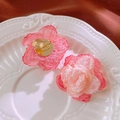 Detailed view of pink handmade lace flower clip-on earrings on a vintage white porcelain plate - Pink Flower Clip-on Earrings
