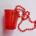 Translucent red party cup with bead chain decoration for festive events - Red