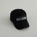 Detailed close-up of embroidered West Virginia lettering on a black cotton baseball cap - 54cm (3-8 Years) / Black