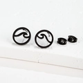 Macro detail of matte black wave-etched circular stud earrings with matching butterfly backs - Sea Wave Style (158) / Black
