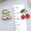 Golden cherry pendant with red rhinestones and size measurement tool for DIY jewelry - Red Rhinestone Cherry (23414)