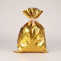 Golden Christmas drawstring gift bag with snowflake texture and white ribbon bow - Medium / Laser Gold