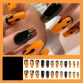 Halloween-Künstliche Nägel mit Kürbis-Motiven und schwarzen Tropfen-Designs 24 Stück - CY375-G Flüssigkeitstropfen Kürbis [Geleekleber + Holzstab + Nagelfeile]