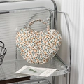Heart-shaped quilted makeup bag with orange floral print and cotton top handle - Yellow Floral
