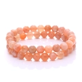 Natürliche orangefarbene Mondstein-Armbänder mit runden Perlen auf weißem Hintergrund - Runde Perlen / Sonnenstein
