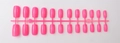 Detailed view of 24 long square fuchsia press-on nails with high gloss UV coating - Fuchsia Pink (CFL-24)