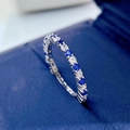 Elegant S925 silver eternity ring with alternating blue and white gemstones on velvet - US 5 / Blue