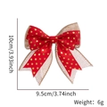 Close-up of burlap and red satin Christmas bow with gold dots for gift wrapping DIY - Red Fabric Gold Dot Style