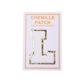 Detail showing white chenille letter L patch with gold glitter edge and adhesive backing - Letter L / White