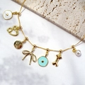 Gold-tone charm bracelet with heart, star, and pearl pendants on textured stone base - Finished Multi-Pendant Necklace