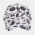 Close-up of white baseball cap with black Halloween pumpkin and bat prints - White Halloween Print Style