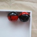 Dual-color 4cm metal bells in black and red finish displayed in a white wooden box - Black Red