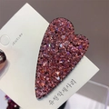 Detail showing a heart-shaped hair clip with shimmering pink Czech rhinestones - Pink