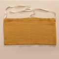 Detailed texture of mustard yellow cotton gauze bedside storage bag with two large pockets - Ginger Yellow
