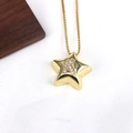 Macro shot of gold star pendant with crystal letter K on a fine box chain necklace - Letter K