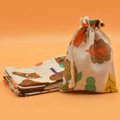 Cotton linen drawstring pouch with owl and leaf prints in beige on orange background - Owl