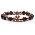 Macro detail of brown tiger eye beads and rose gold crown charm with black zircons - Yellow Tiger Eye Rose Gold