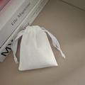 White velvet drawstring pouch with satin ribbon for jewelry storage and protection - White