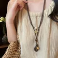 Retro ethnic style long necklace with wood beads and bronze star pendant on model - Style 5-Coffee-Star