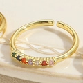 Close-up of gold adjustable open ring featuring a row of vibrant colorful zircon stones - Adjustable Open / Colorful Zirconia Style (JZ0333)