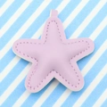 Purple leather starfish keychain charm with stitching detail on blue striped background - Light Purple