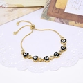 Adjustable gold heart bracelet with black enamel evil eye and micro-pave zircons - Black