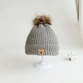 Gray knitted baby winter hat with fur pom-pom and Lucky Bear leather patch - Bear Label Single Hat / Gray