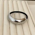Minimalist black elastic hair tie with a crescent-shaped silver metal buckle variant - Silver