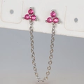 Macro detail of silver ear chain with pink zircon clover studs on display card - Silver Rose Red Rhinestone