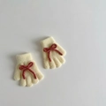 Flat lay of cream yellow knitted gloves with red bow details on a white background - Approx. 2-6 Years Old / Warm Yellow