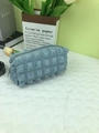 Light blue bubble puff quilted makeup bag with zipper closure and soft textured fabric - Blue