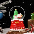 Christmas carousel music box featuring Santa Claus and snowman in red cake base - Snowman/Red