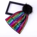 Colorful metallic knit beanie with a large faux fur pompom on a clean white background - One Size / Colorful