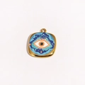 Detail view of a square gold evil eye pendant with blue and orange enamel star pattern - Starry Sky Orange Eye Style (Style 2)