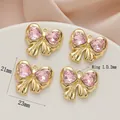 Golden alloy bow pendant with pink heart crystals, four pieces set, width 23mm, height 21mm - 763# Gold - Pink Zirconia