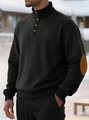 Detailed macro view of waffle texture fabric and faux suede elbow patches on sweatshirt - S / Black
