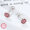 Macro view of 925 sterling silver flower earrings with red glaze and screw ball backs - Silver Red