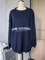 Detail of navy blue oversized knit sweater featuring EME STUDIOS letter print on the chest - S / Navy Blue