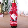Knitted Santa gnome wine bottle cover in red and grey with festive ribbon bow and pompoms - Red