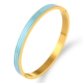 Detail of gold-tone bangle with blue and white stripes and brushed metal inner surface - Gold Blue