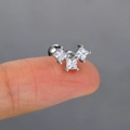 Macro shot of silver stud earring with three square clear zircons held on a finger - 5# Three Square Stones / Platinum
