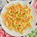 Close-up of dual-color butterfly beads with pre-drilled holes for DIY hair accessories - Straight Hole / Yellow